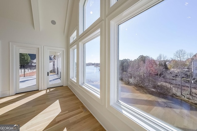 sunroom with a water view