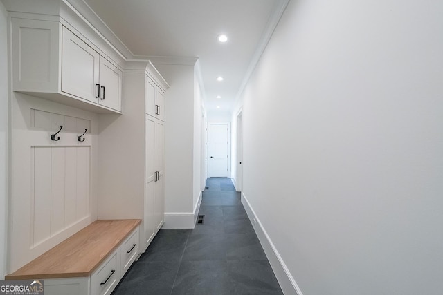 mudroom featuring crown molding