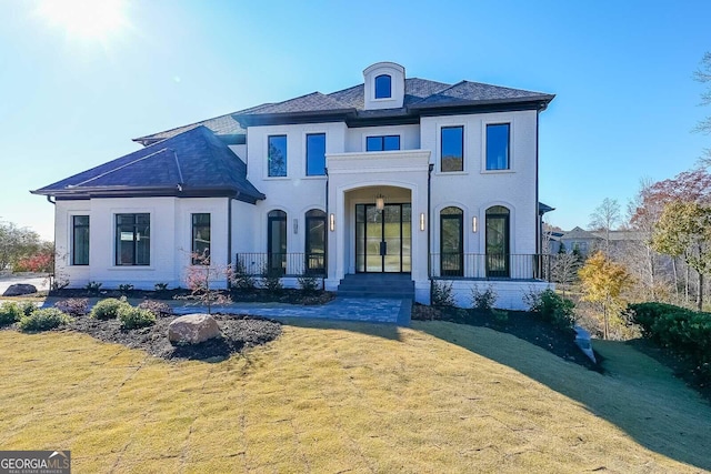 view of front of house featuring a front yard and a porch