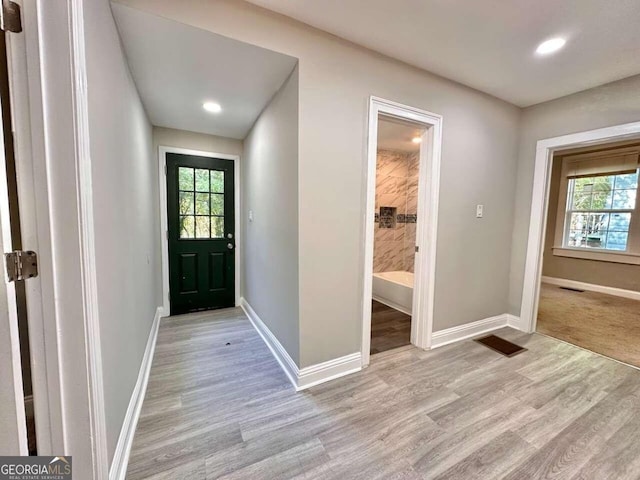 entryway with light hardwood / wood-style flooring