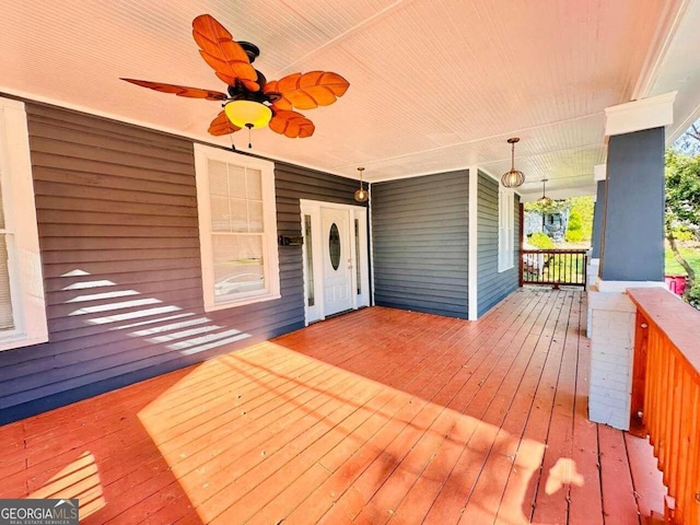 wooden deck with ceiling fan and covered porch