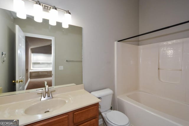 full bathroom with vanity, shower / bath combination, and toilet