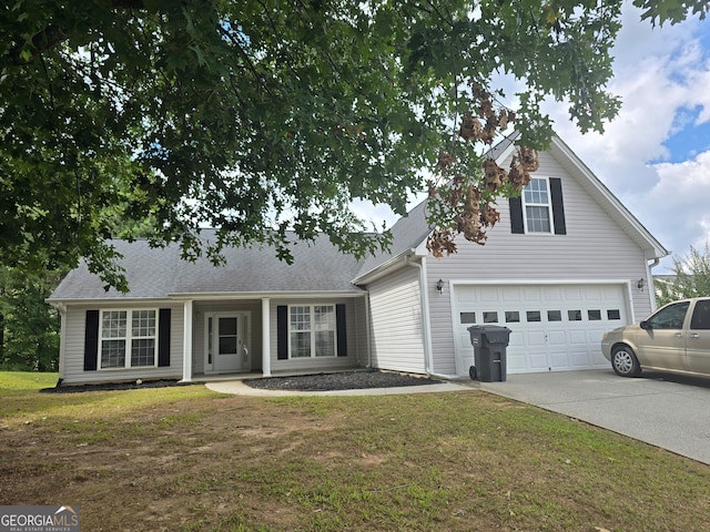 view of front of property featuring a garage and a front yard