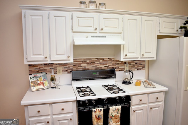 kitchen featuring decorative backsplash, white appliances, range hood, and white cabinetry