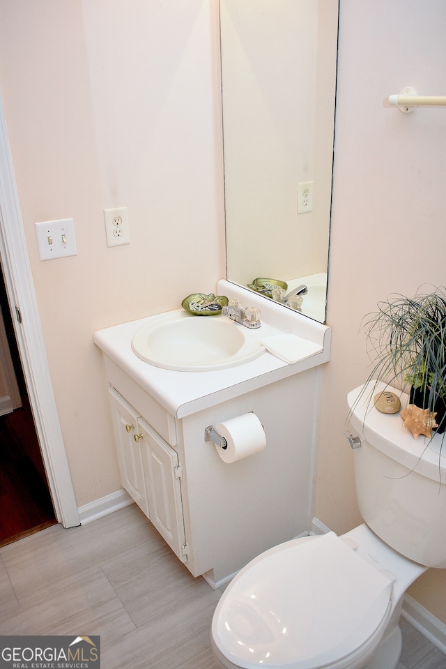 bathroom with vanity and toilet