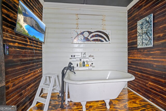 bathroom with wooden walls and a washtub