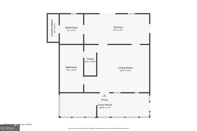 view of outdoor structure with a yard and a sunroom