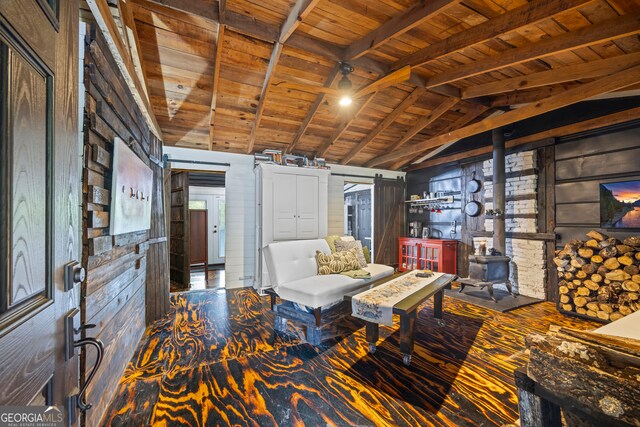 sitting room featuring wooden ceiling, lofted ceiling with beams, and wood walls