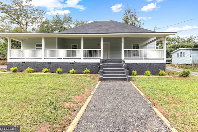 view of front facade with a front lawn and covered porch