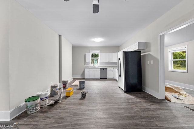 kitchen featuring white cabinetry, dark hardwood / wood-style flooring, stainless steel appliances, ceiling fan, and sink