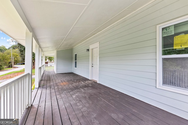 wooden terrace featuring covered porch