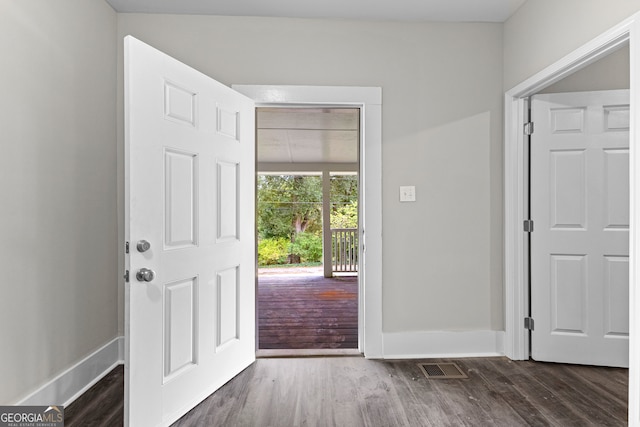 entryway with dark wood-type flooring