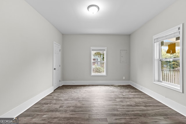 spare room featuring dark hardwood / wood-style floors