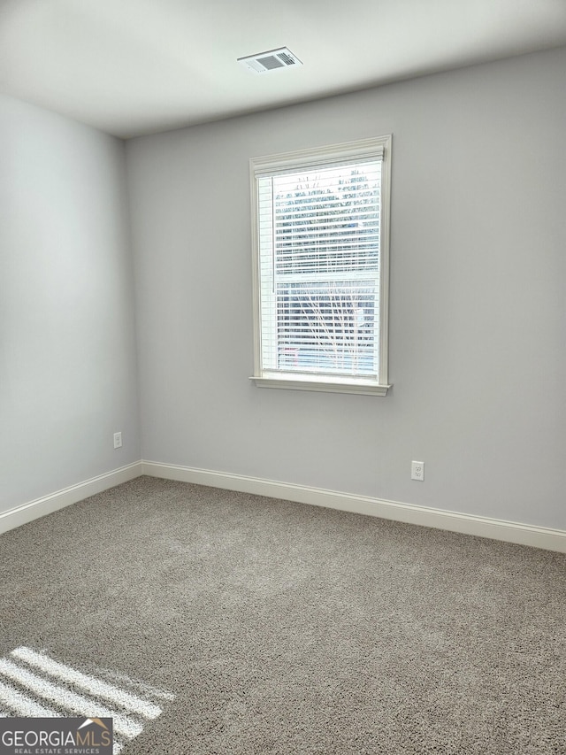 unfurnished room with carpet floors