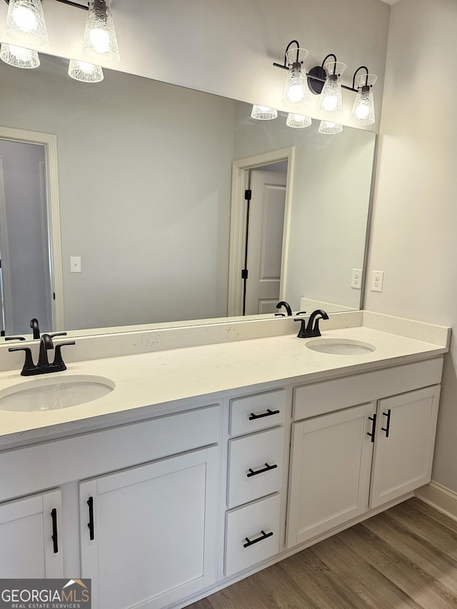 bathroom with wood-type flooring and vanity