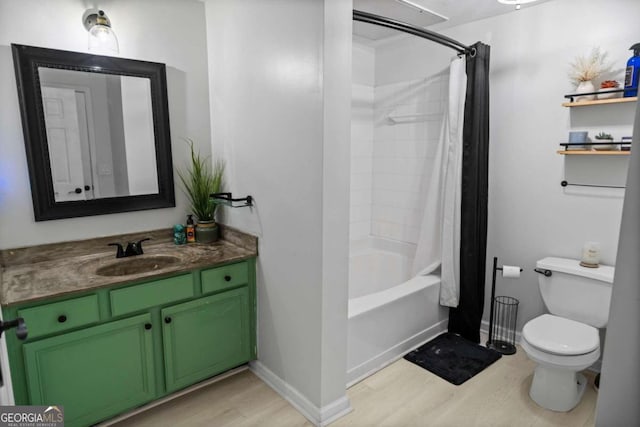 full bathroom with vanity, hardwood / wood-style floors, toilet, and shower / bathtub combination with curtain