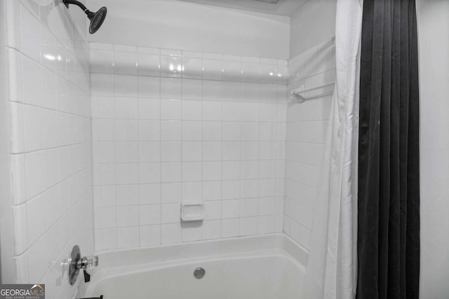 bathroom with shower / tub combo with curtain