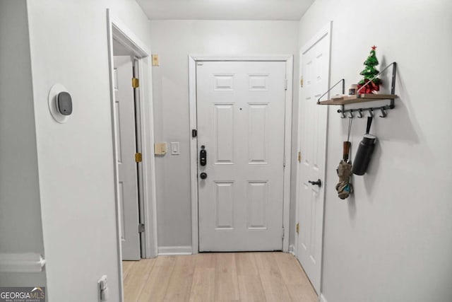 2700 Pine St NE Unit 2108, Atlanta, GA 30324 - doorway to outside with light wood-style flooring and baseboards