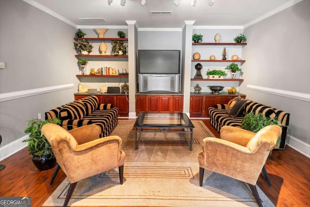 interior space with hardwood / wood-style flooring and ornamental molding