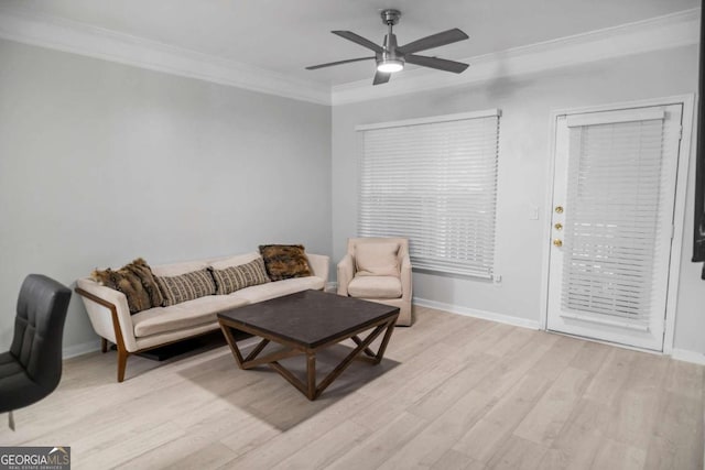 living room with ceiling fan, light hardwood / wood-style flooring, and ornamental molding