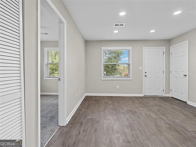 interior space with dark hardwood / wood-style floors