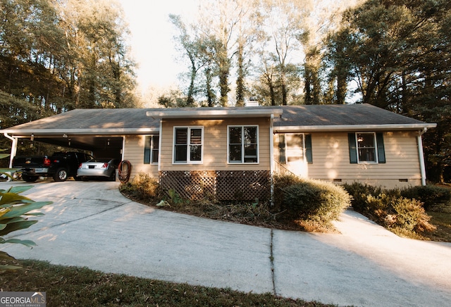 ranch-style home featuring a carport