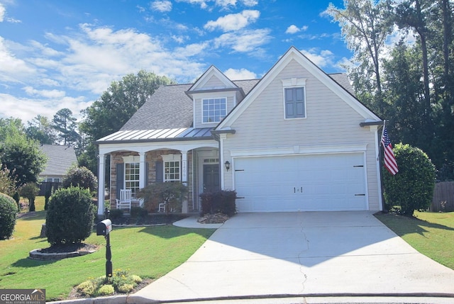 view of front of home with a front yard and a garage