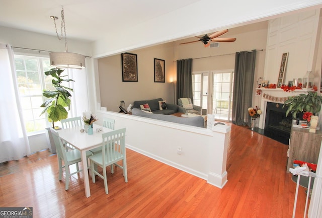 dining space featuring ceiling fan and hardwood / wood-style floors