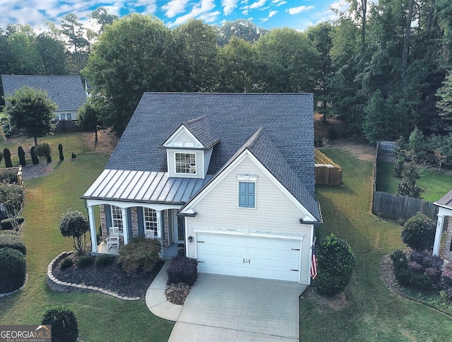 view of front of home with a garage and a front yard