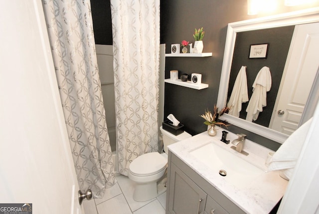 bathroom featuring curtained shower, tile patterned flooring, vanity, and toilet