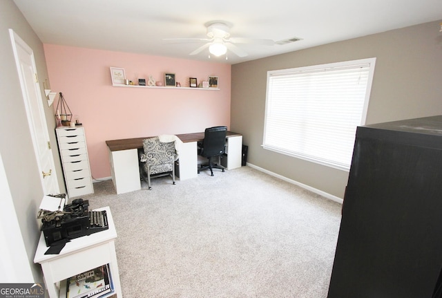 office space with ceiling fan and light colored carpet