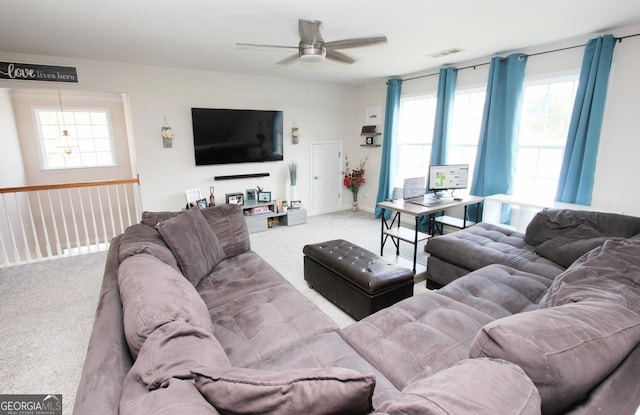 living room featuring carpet flooring and ceiling fan