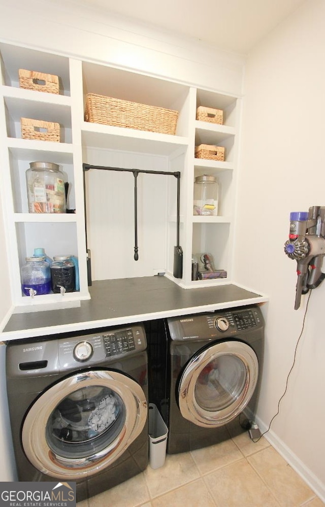 washroom with light tile patterned floors and independent washer and dryer