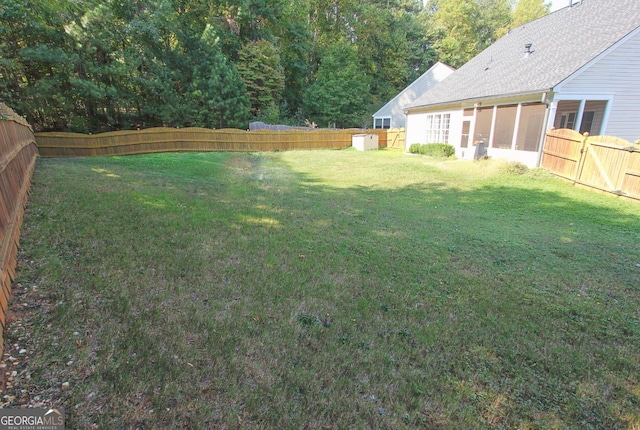 view of yard featuring a sunroom