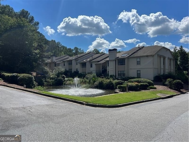 view of front of home featuring a water view