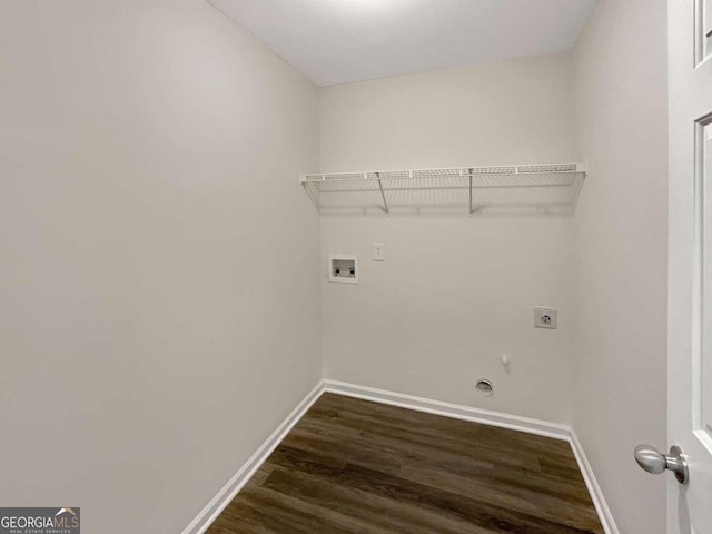 laundry room with washer hookup, electric dryer hookup, gas dryer hookup, and dark hardwood / wood-style flooring