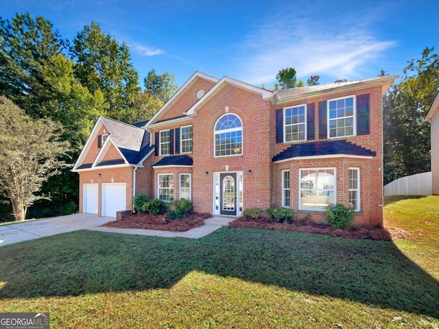 view of front of property with a garage and a front lawn