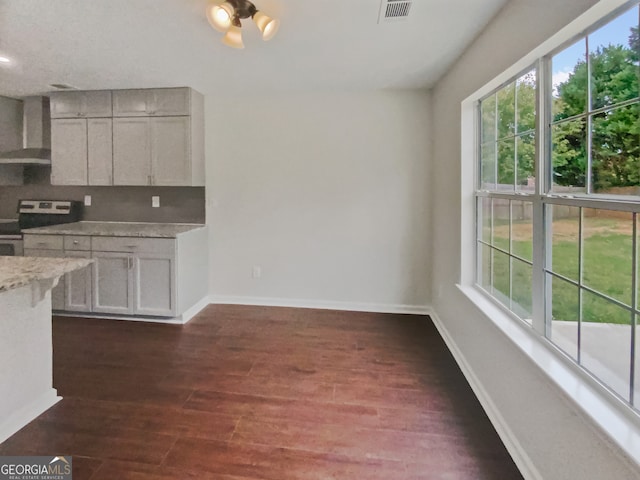 kitchen with dishwasher, sink, white cabinetry, kitchen peninsula, and dark hardwood / wood-style flooring