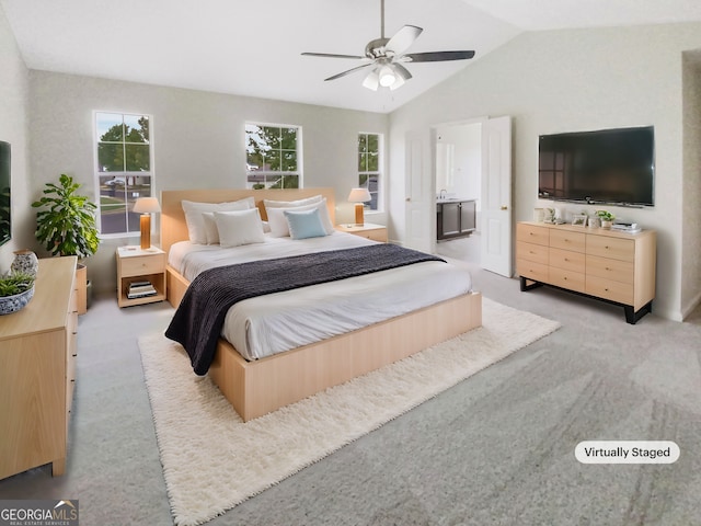 carpeted bedroom featuring lofted ceiling and ceiling fan