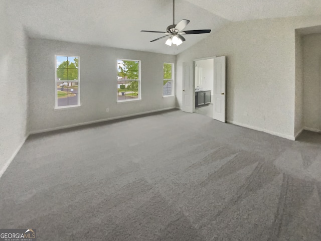 interior space featuring vaulted ceiling and ceiling fan