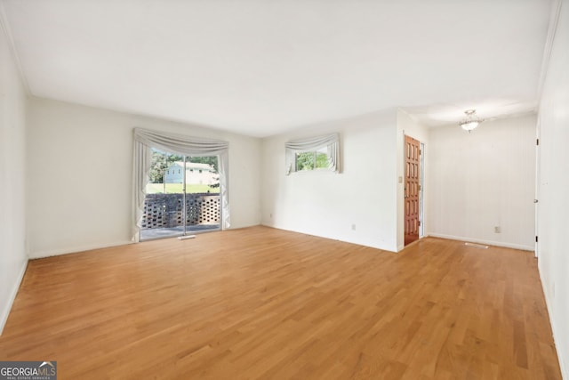 unfurnished room with light hardwood / wood-style floors