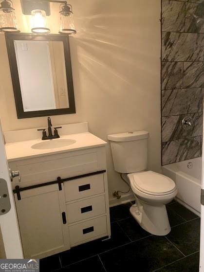 full bathroom with tile patterned flooring, vanity, toilet, and tiled shower / bath combo