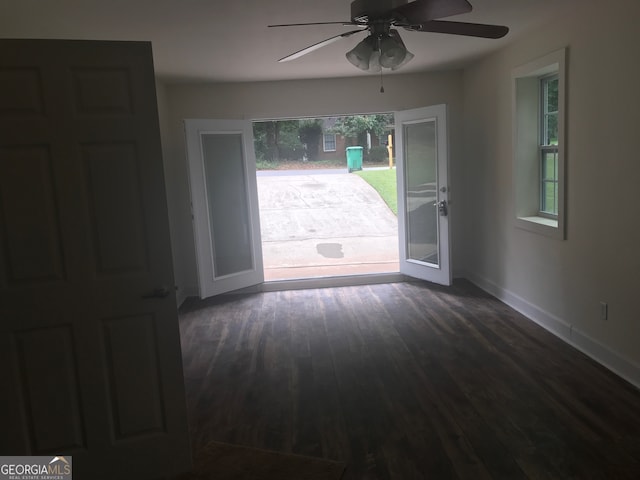 entryway with ceiling fan, dark hardwood / wood-style flooring, and french doors