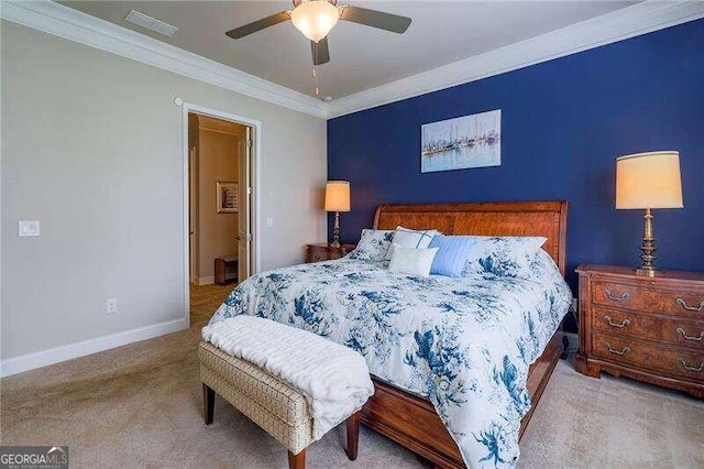 bedroom with ceiling fan, light colored carpet, and crown molding