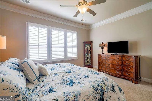 bedroom featuring ceiling fan, light colored carpet, and ornamental molding