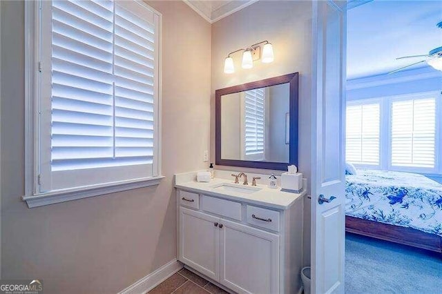 bathroom featuring crown molding, vanity, and ceiling fan