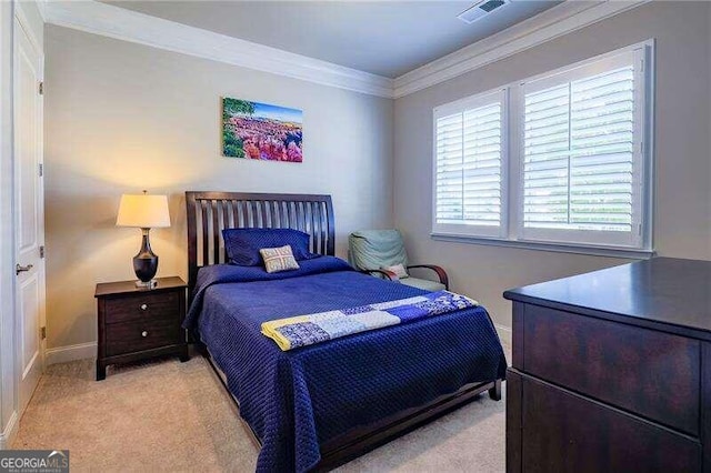 carpeted bedroom featuring crown molding