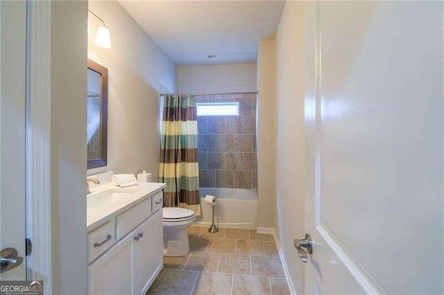 full bathroom featuring shower / tub combo with curtain, vanity, and toilet