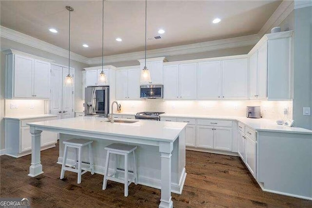 kitchen featuring dark hardwood / wood-style floors, white cabinetry, sink, and stainless steel appliances