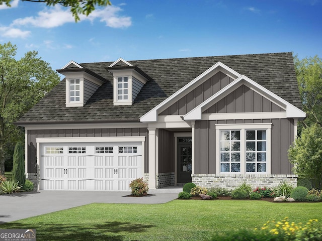 view of front of property with a garage and a front lawn